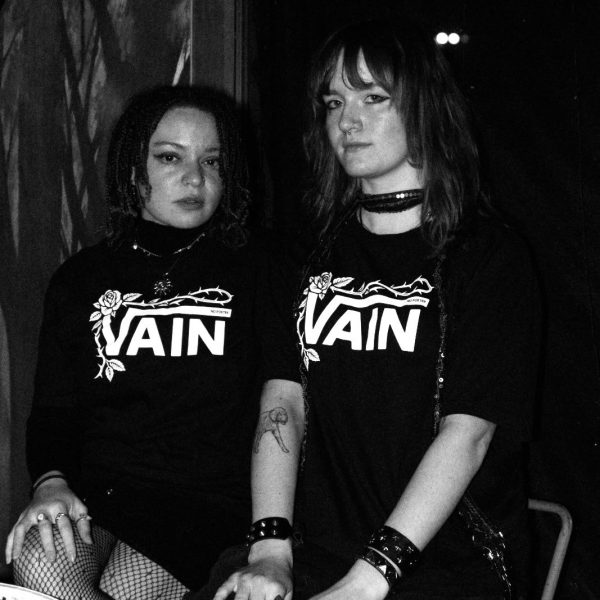 No Poetry black VAIN streetwear T-shirts shown indoors in a dimly lit space