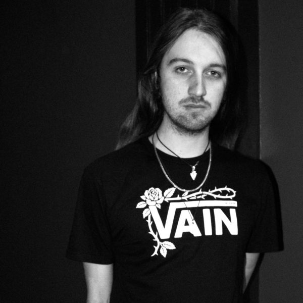 No Poetry black VAIN streetwear T-shirt against a dark background.
