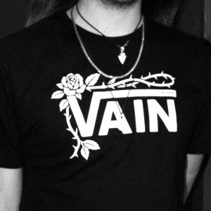 No Poetry black VAIN streetwear T-shirt against a dark background.